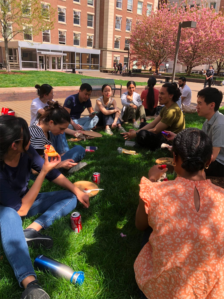 April 2023: Enjoying lunch in the spring outdoors after a collaborative lab clean-up.