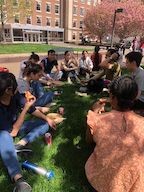 April 2023: Enjoying lunch in the spring outdoors after a collaborative lab clean-up.