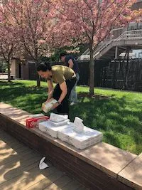 April 2023: Enjoying lunch in the spring outdoors after a collaborative lab clean-up.